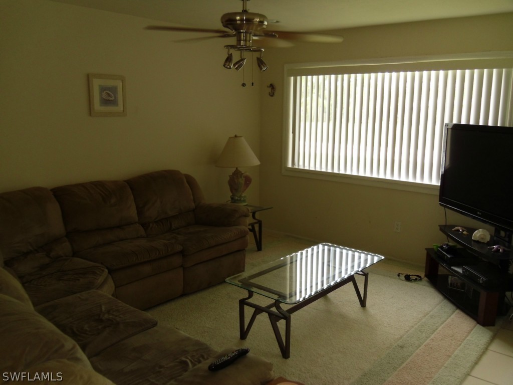18583 Evergreen Road Fort Myers, FL 33967 - Photo 4 of 17 a living room with furniture and a window