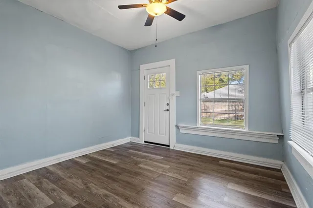 a view of an empty room with a window