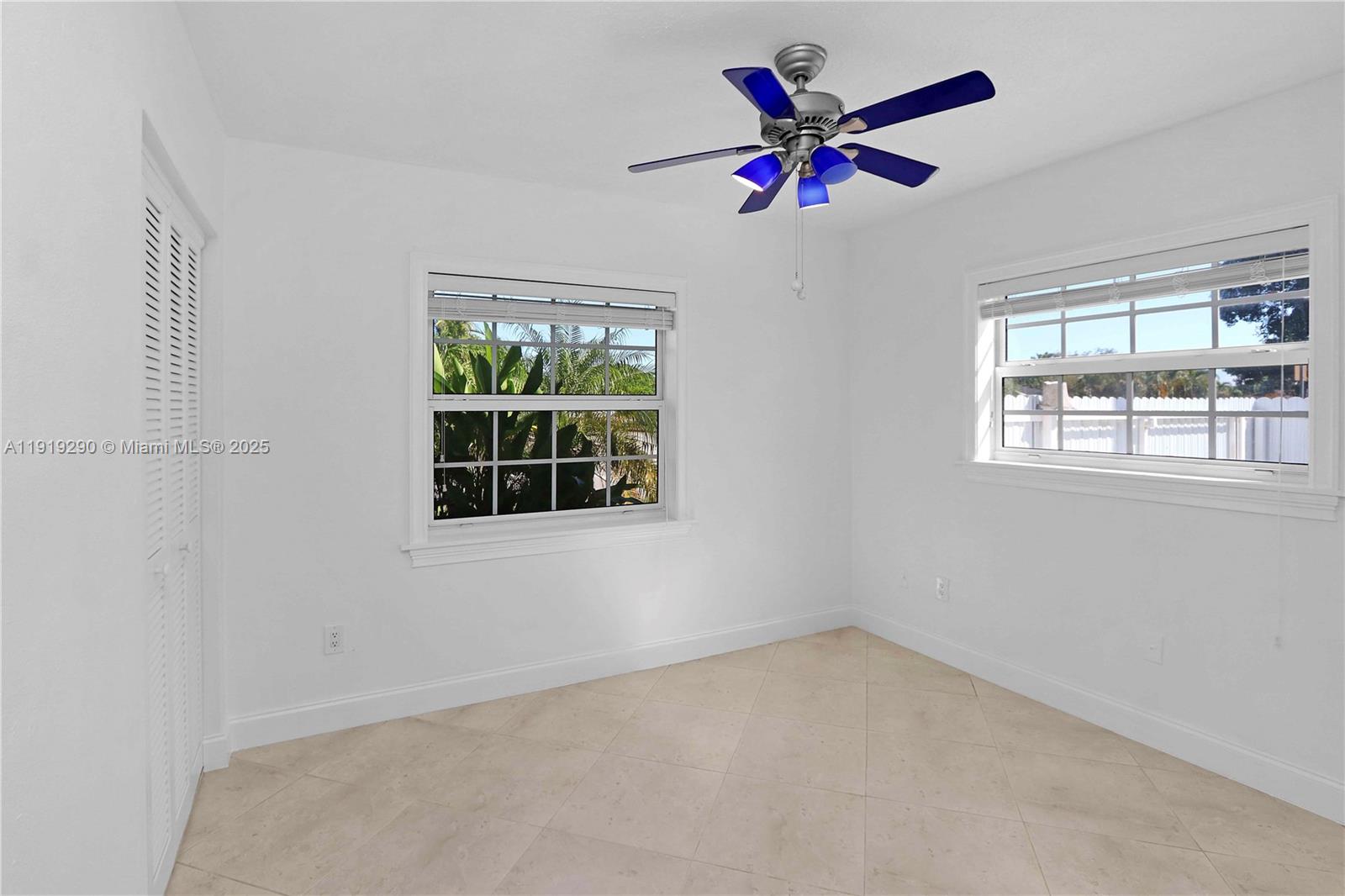 15440 Southwest 102nd Place Miami, FL 33157 - Photo 11 of 30 an empty room with ceiling fan and window