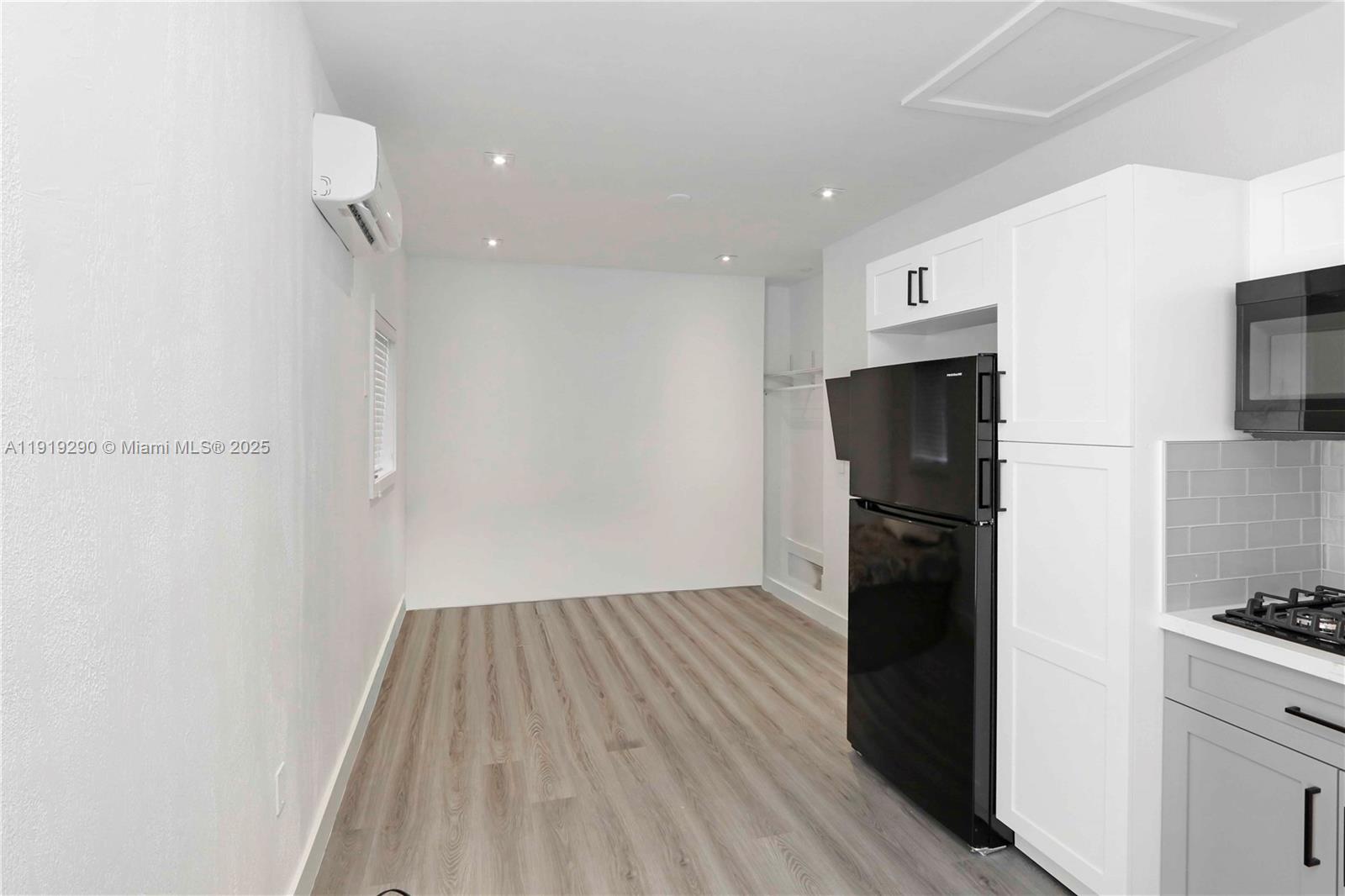15440 Southwest 102nd Place Miami, FL 33157 - Photo 16 of 30 a view of a kitchen with a refrigerator and a stove top oven