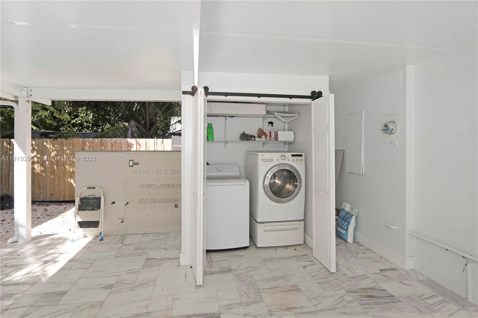15440 Southwest 102nd Place Miami, FL 33157 - Photo 20 of 30 a view of a storage & utility room with washer and dryer