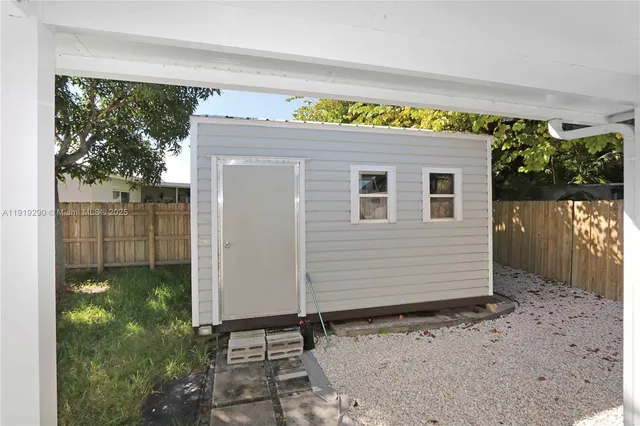 a view of a house with a yard and garage