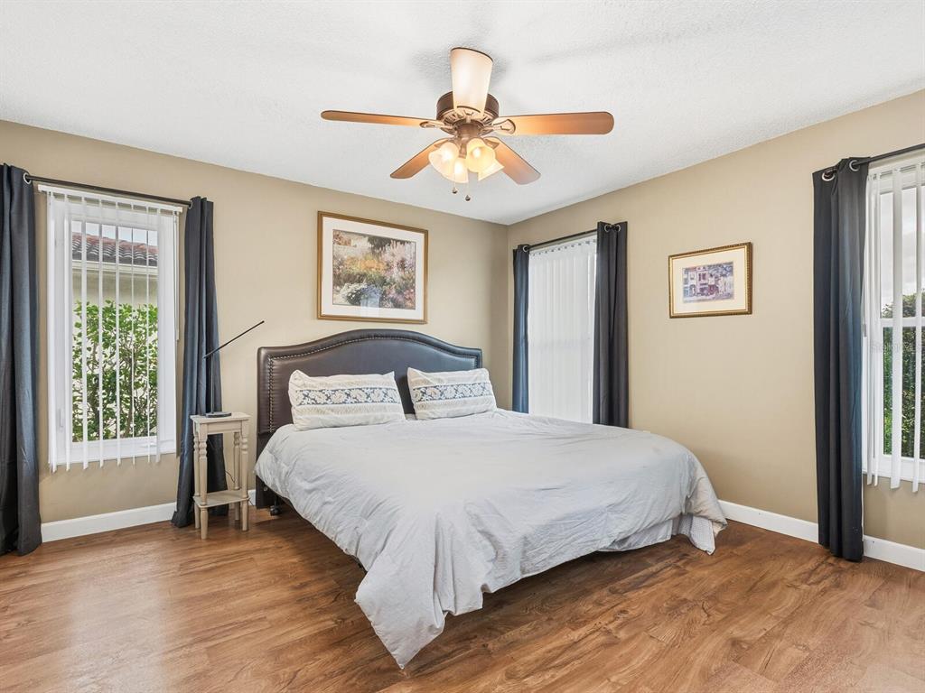 5107 Greencroft Road, Unit 23 Sarasota, FL 34235 - Photo 11 of 35 a bedroom with a large bed and a window