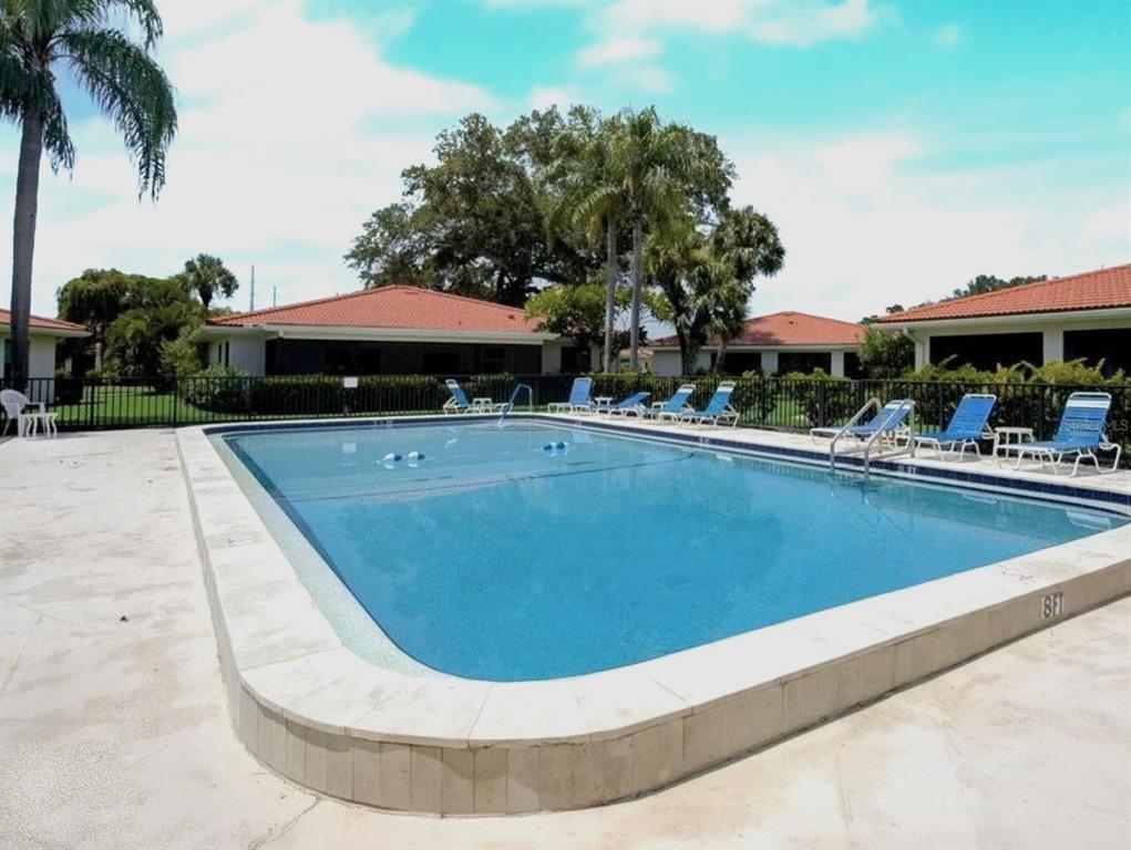 5107 Greencroft Road, Unit 23 Sarasota, FL 34235 - Photo 17 of 35 a view of outdoor space yard and swimming pool