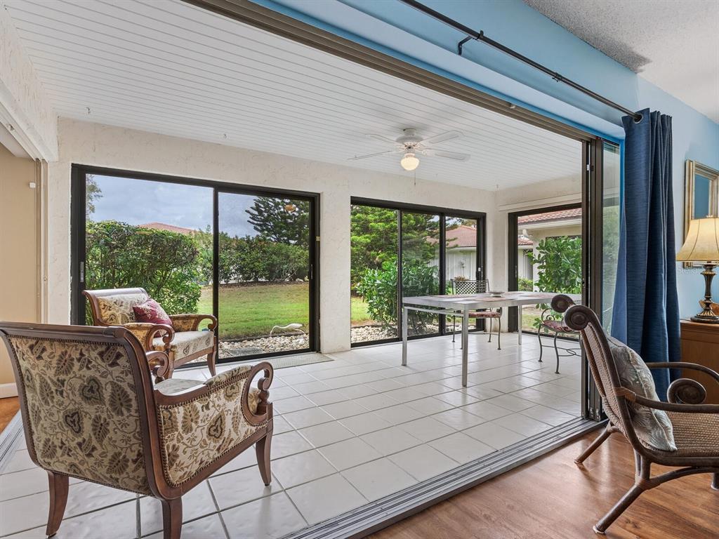 5107 Greencroft Road, Unit 23 Sarasota, FL 34235 - Photo 3 of 35 a living room with furniture and a large window