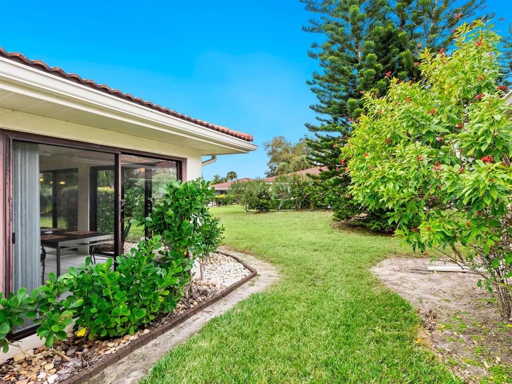 5107 Greencroft Road, Unit 23 Sarasota, FL 34235 - Photo 4 of 35 a view of a house with a yard