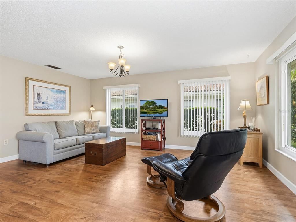 5107 Greencroft Road, Unit 23 Sarasota, FL 34235 - Photo 5 of 35 a living room with furniture and a window