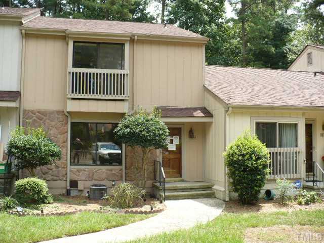 814 Green Ridge Drive Raleigh, NC 27609 - Photo 1 of 7 a view of a house with brick walls and a yard