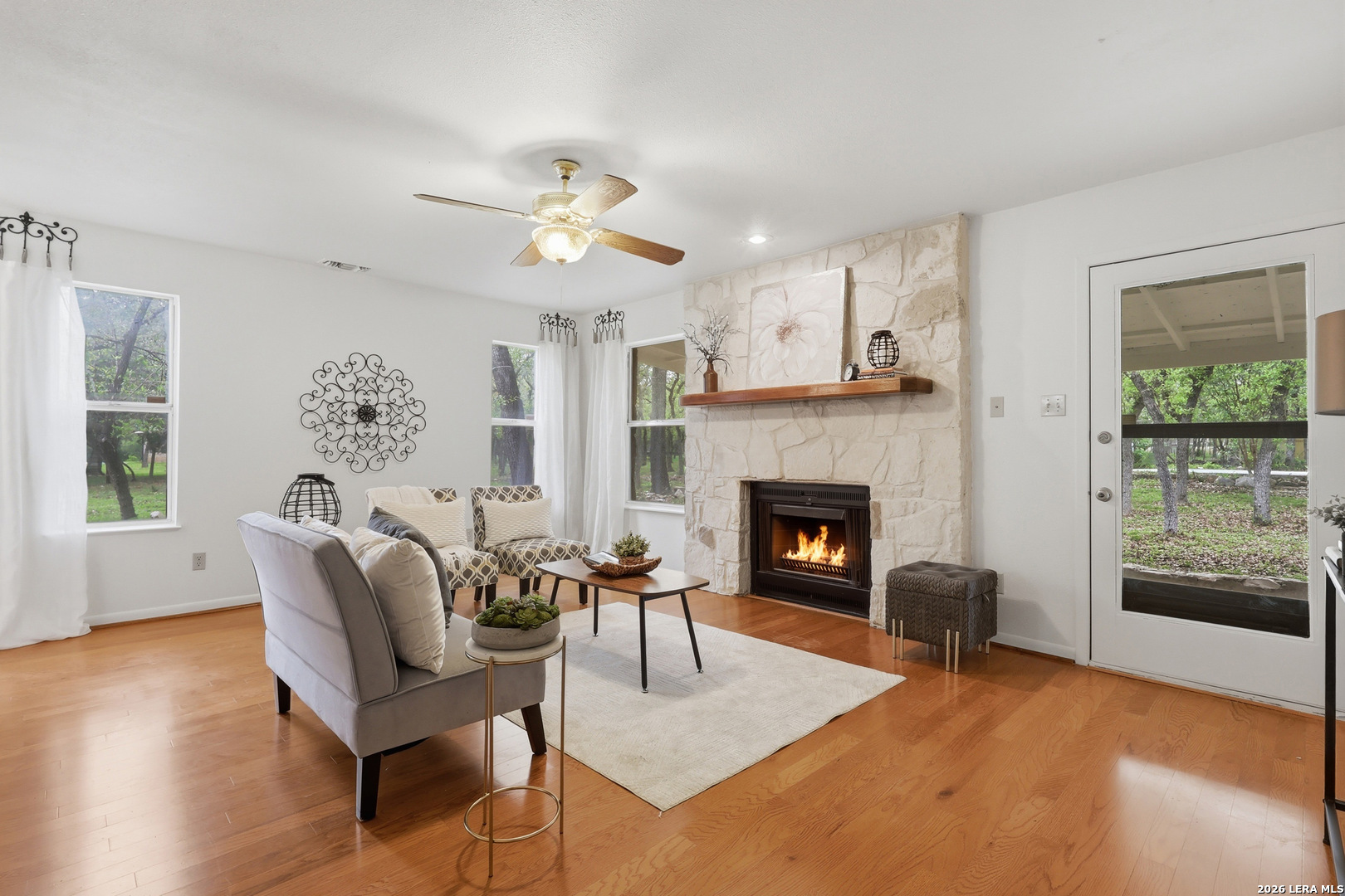 261 Fawn Lane Spring Branch, TX 78070 - Photo 8 of 44 a living room with furniture and a fireplace