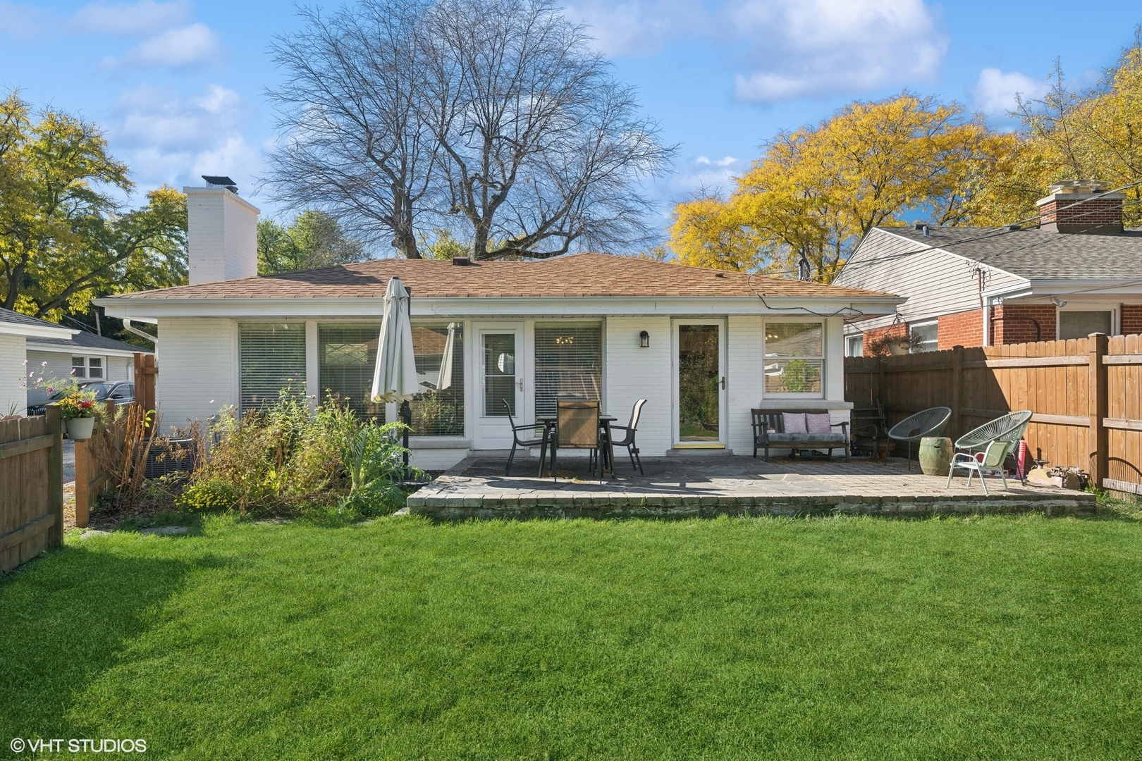 930 Hunter Road Wilmette, IL 60091 - Photo 21 of 26 a view of a house with a yard and sitting area