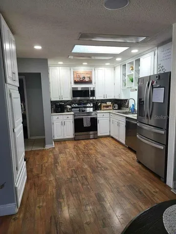 a view of living room filled with furniture and window