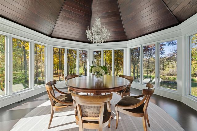 a kitchen with stainless steel appliances granite countertop a stove and white cabinets