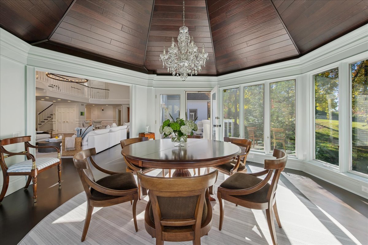 166 North Buckley Road Barrington Hills, IL 60010 - Photo 15 of 86 a dining room with furniture a chandelier and wooden floor