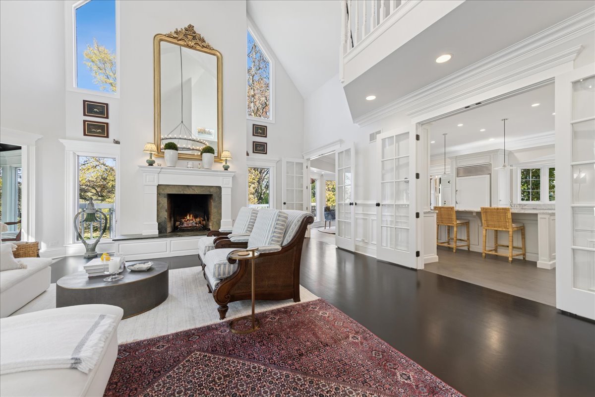 166 North Buckley Road Barrington Hills, IL 60010 - Photo 16 of 86 a living room with furniture fireplace and kitchen view