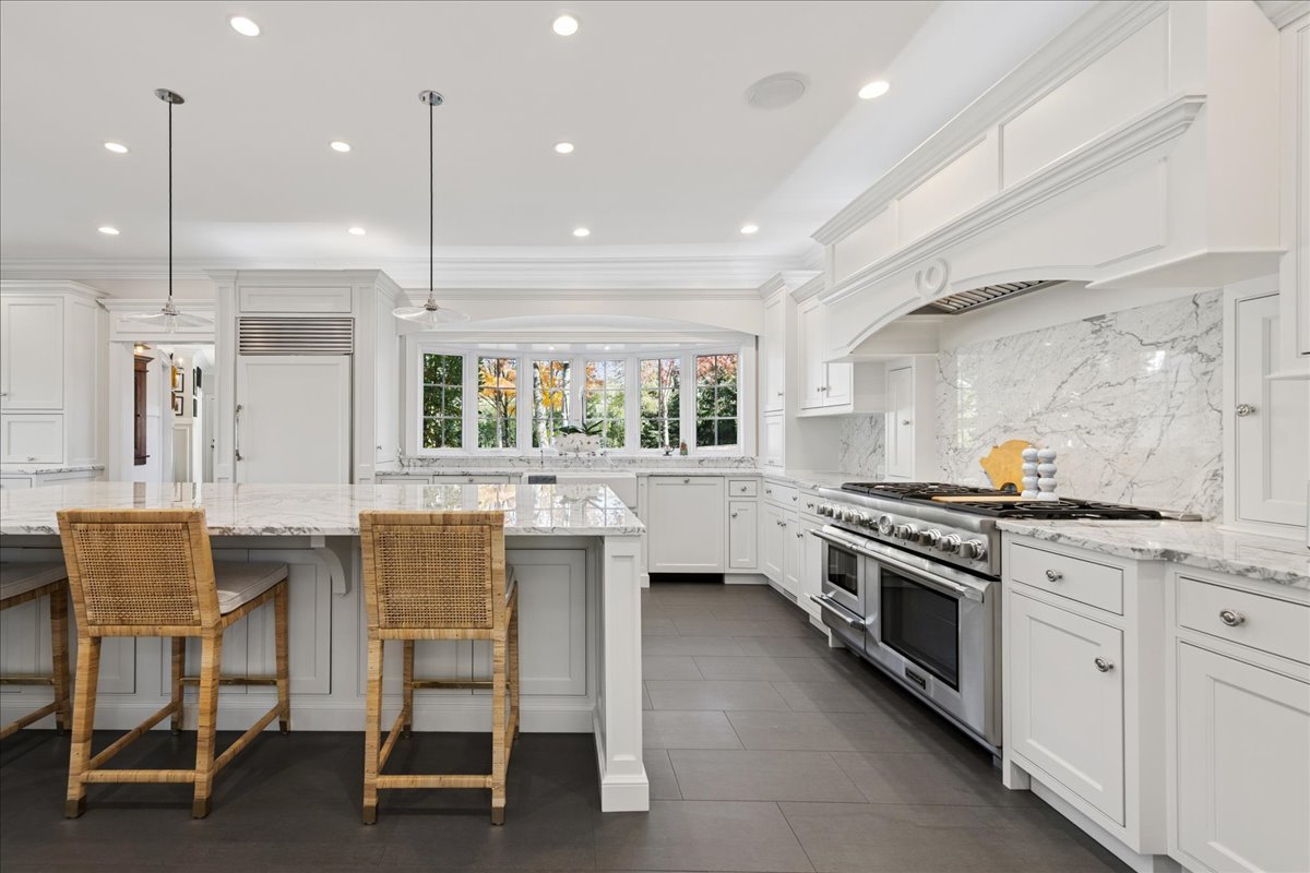 166 North Buckley Road Barrington Hills, IL 60010 - Photo 17 of 86 a kitchen with stainless steel appliances granite countertop a stove and a refrigerator