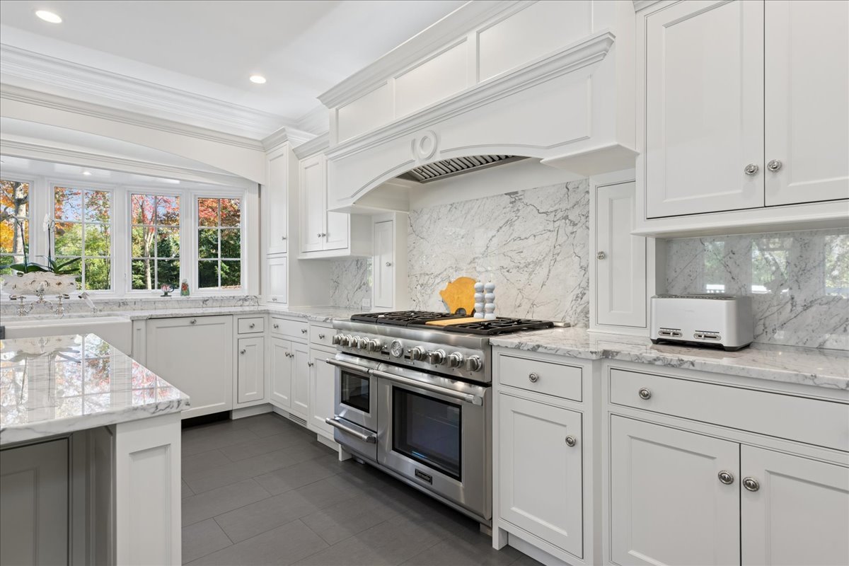 166 North Buckley Road Barrington Hills, IL 60010 - Photo 22 of 86 a kitchen with stainless steel appliances granite countertop a stove and a sink