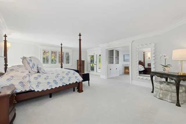 a bedroom with furniture and a window