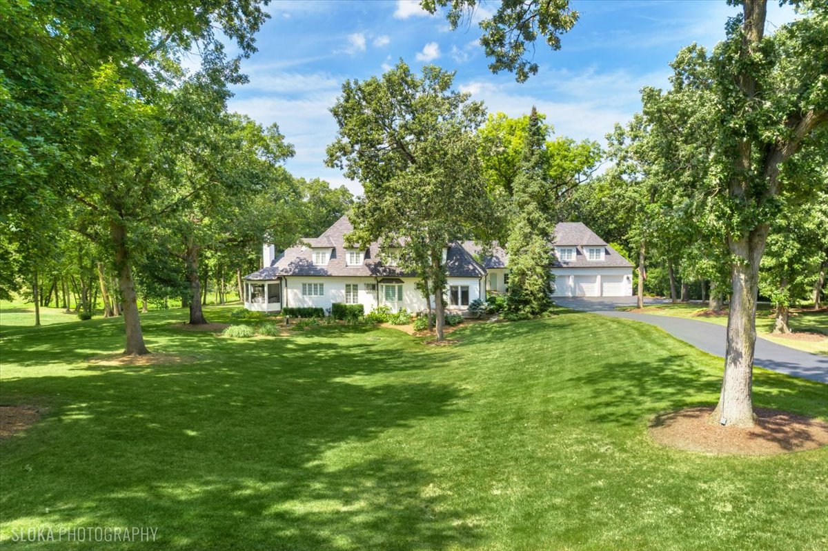 166 North Buckley Road Barrington Hills, IL 60010 - Photo 4 of 86 a front view of a house with garden