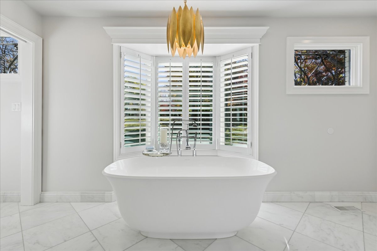 166 North Buckley Road Barrington Hills, IL 60010 - Photo 42 of 86 a white bath tub sitting in a bathroom