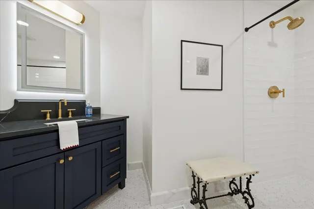 a view of a house with a yard and large tree