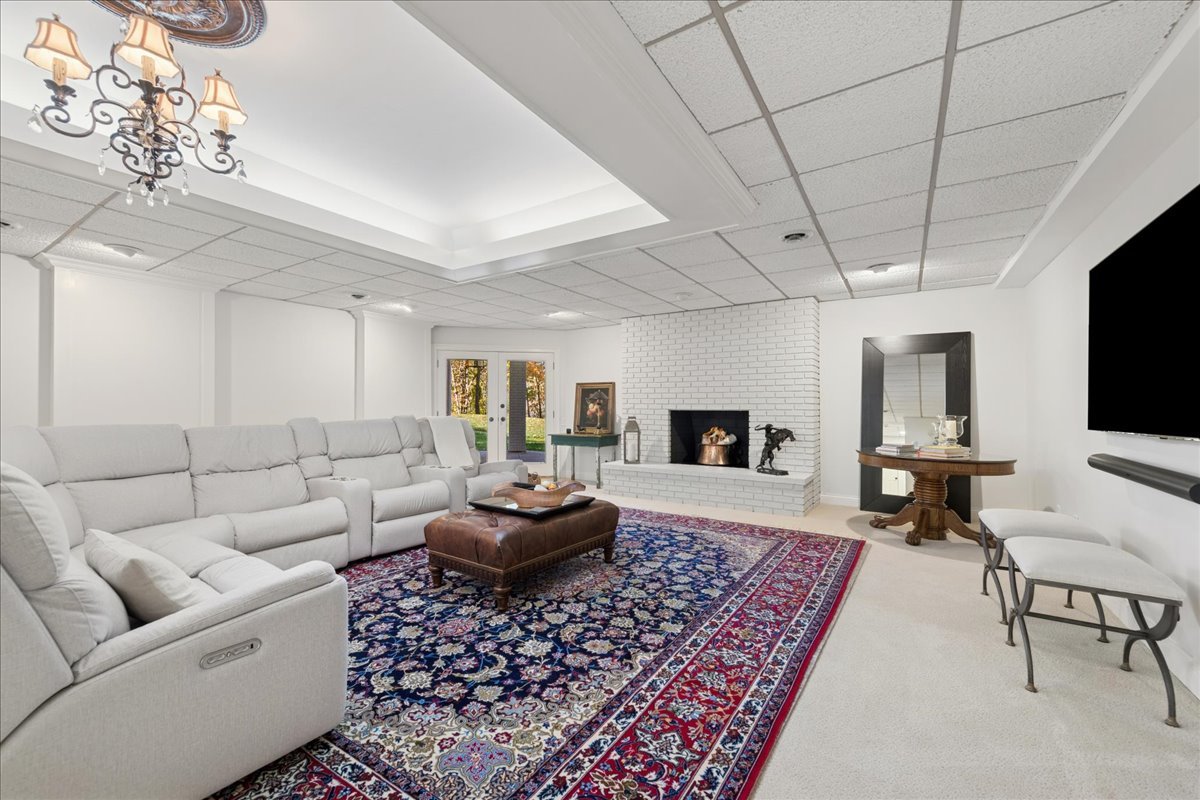 166 North Buckley Road Barrington Hills, IL 60010 - Photo 59 of 86 a living room with furniture and a flat screen tv