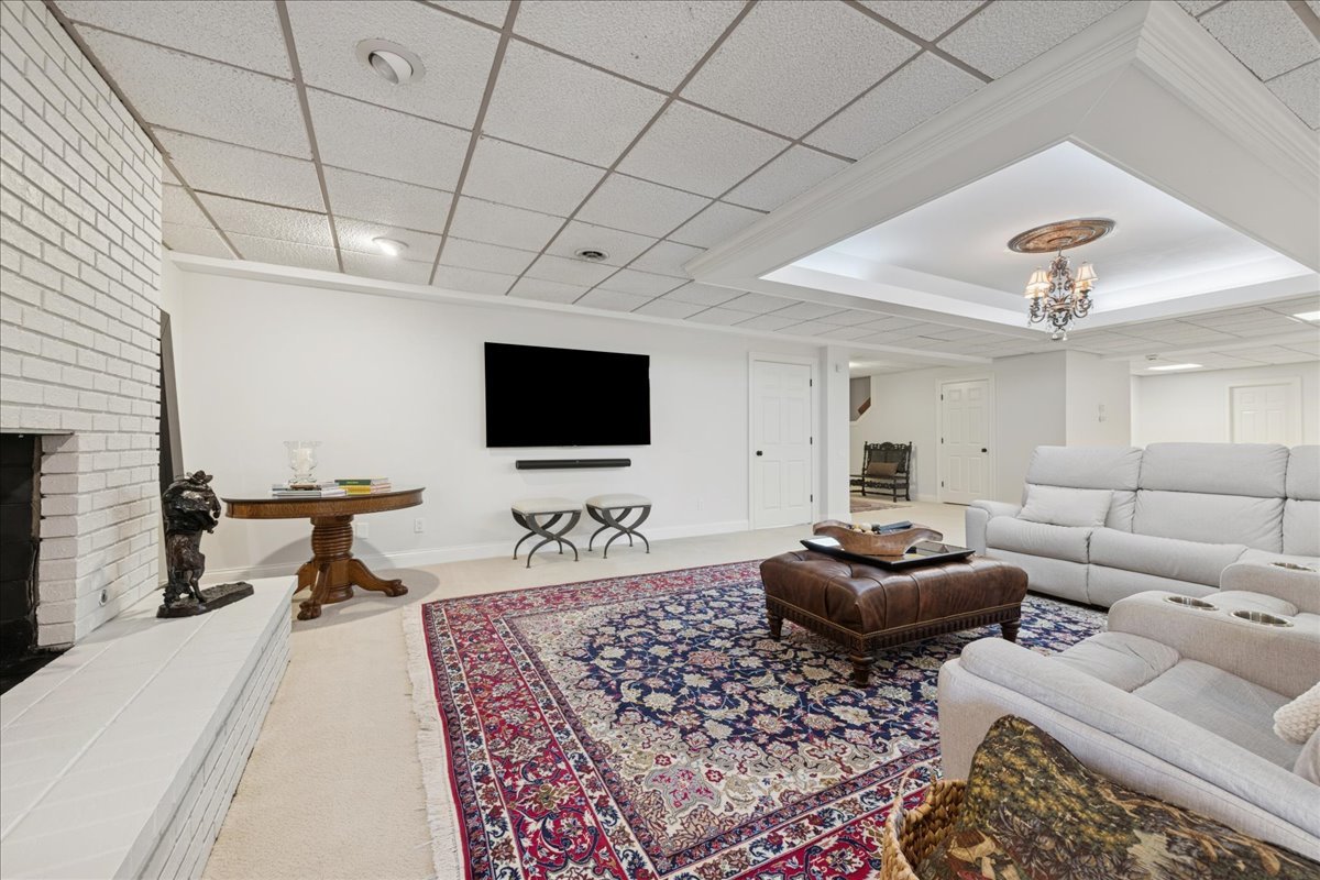 166 North Buckley Road Barrington Hills, IL 60010 - Photo 61 of 86 a living room with furniture and a flat screen tv