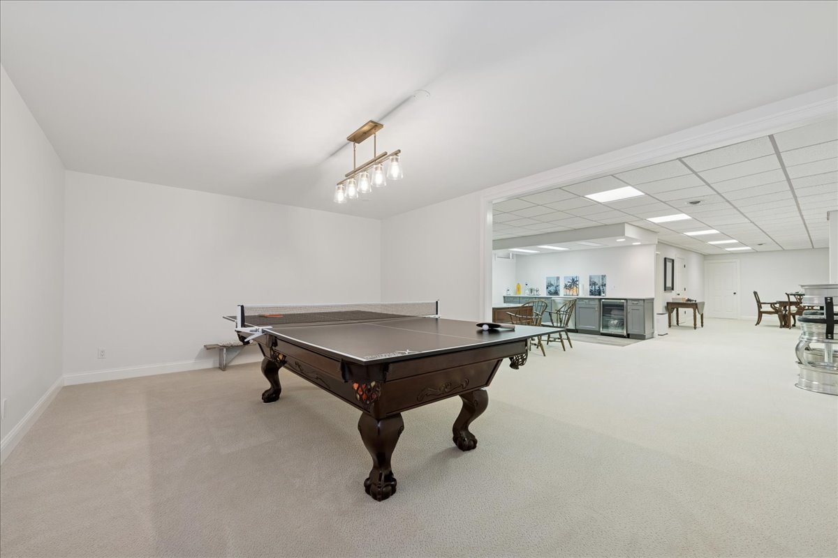 166 North Buckley Road Barrington Hills, IL 60010 - Photo 66 of 86 a room with lots of furniture and a chandelier