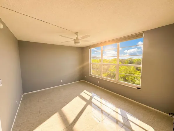 a view of an empty room and a window