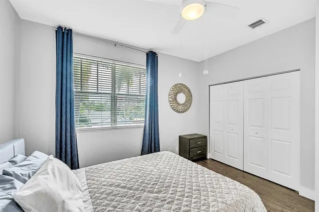 a view of a hallway with wooden floor and stairs