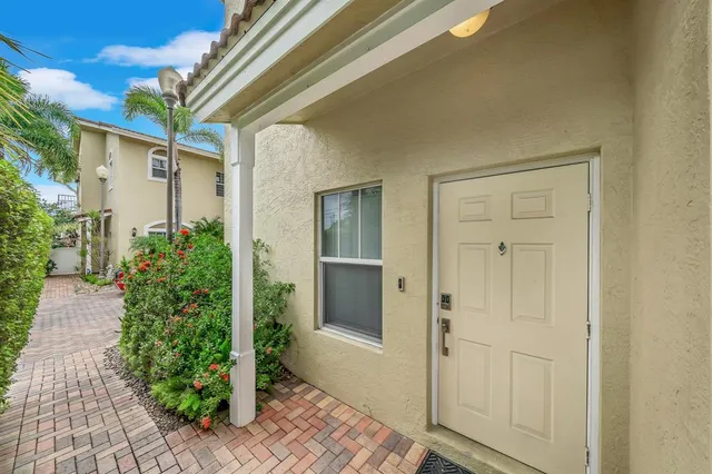 a view of a porch with potted plants