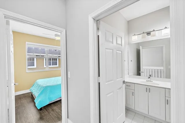 a bathroom with a double vanity sink mirror and