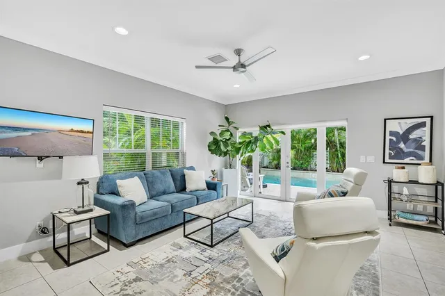 a living room with furniture and a large window