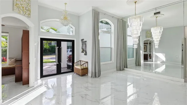 a view of a hallway with wooden cabinet and door
