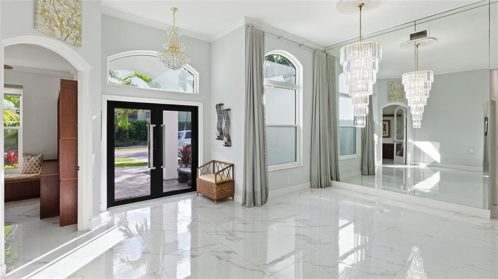 10141 Umberland Place Boca Raton, FL 33428 - Photo 5 of 28 a view of a hallway with wooden cabinet and door