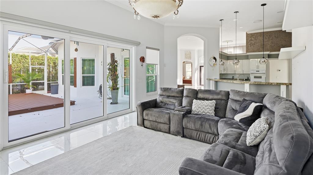 10141 Umberland Place Boca Raton, FL 33428 - Photo 9 of 28 a living room with furniture and a large window