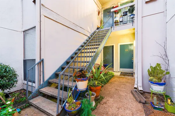 a front view of a house with a garden and entryway