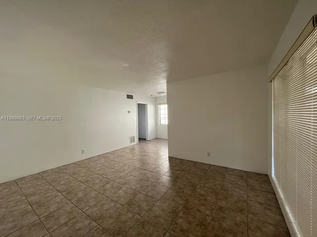 an empty room with an entryway