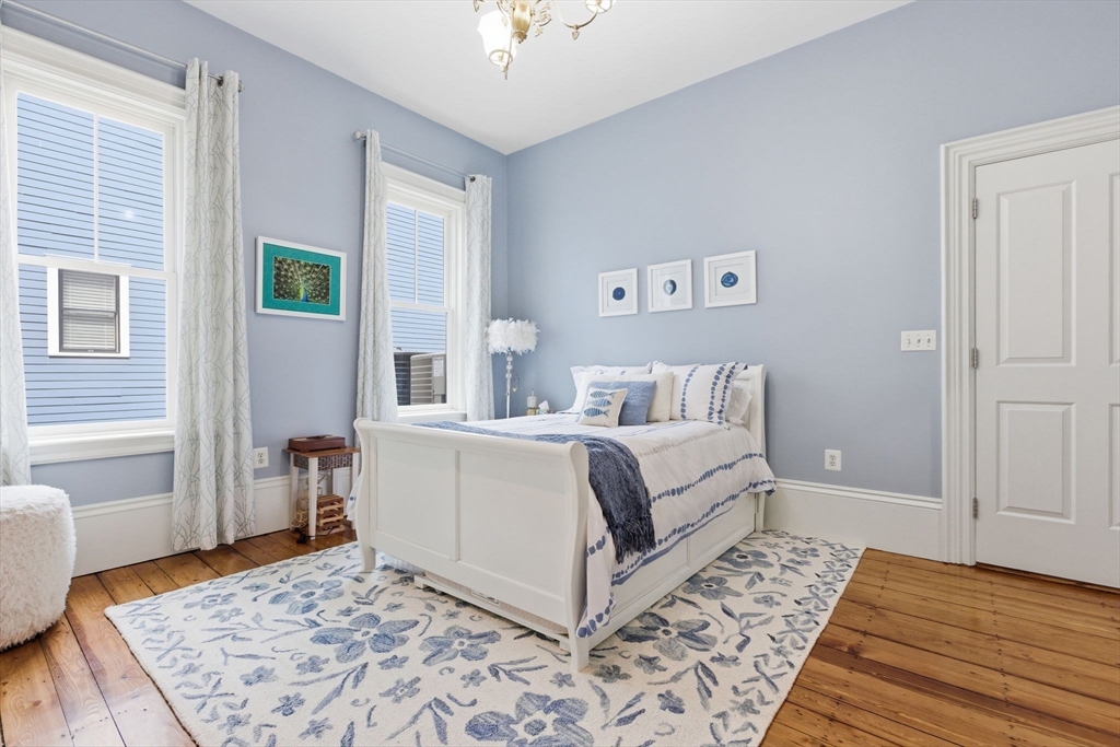419 Main Street Boston, MA 02129 - Photo 15 of 41 a living room with a bed and a couch