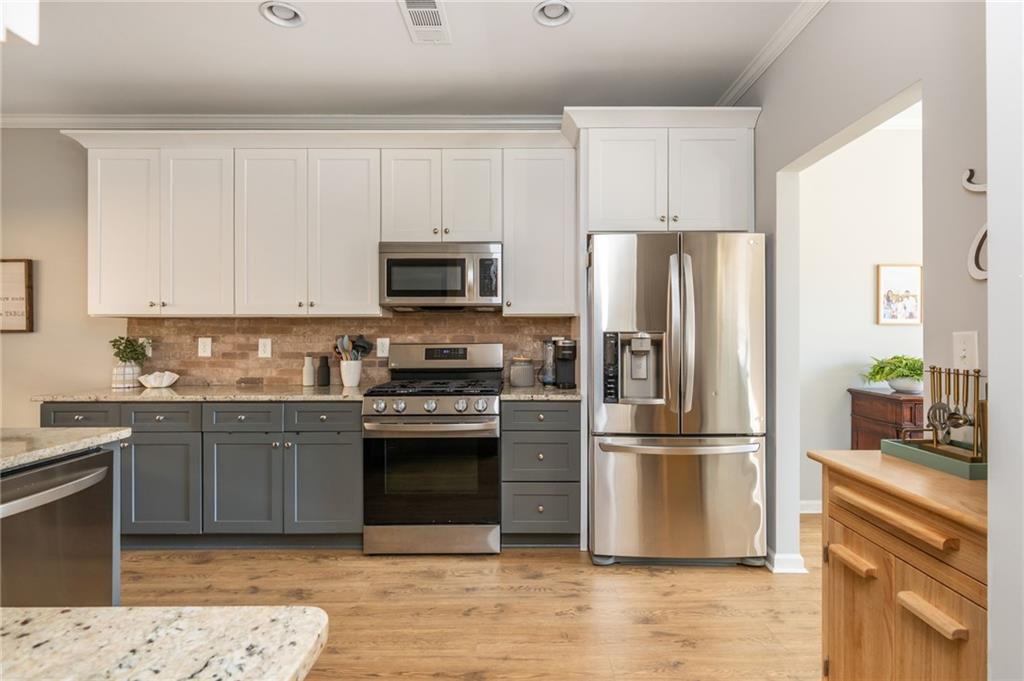 503 Pinnacle Court Canton, GA 30115 - Photo 13 of 51 a kitchen with stainless steel appliances granite countertop a refrigerator stove and microwave