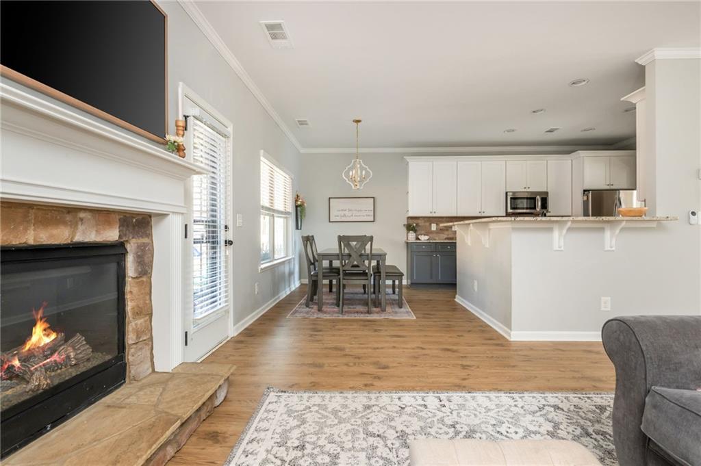 503 Pinnacle Court Canton, GA 30115 - Photo 19 of 51 a dining room with furniture and a fireplace