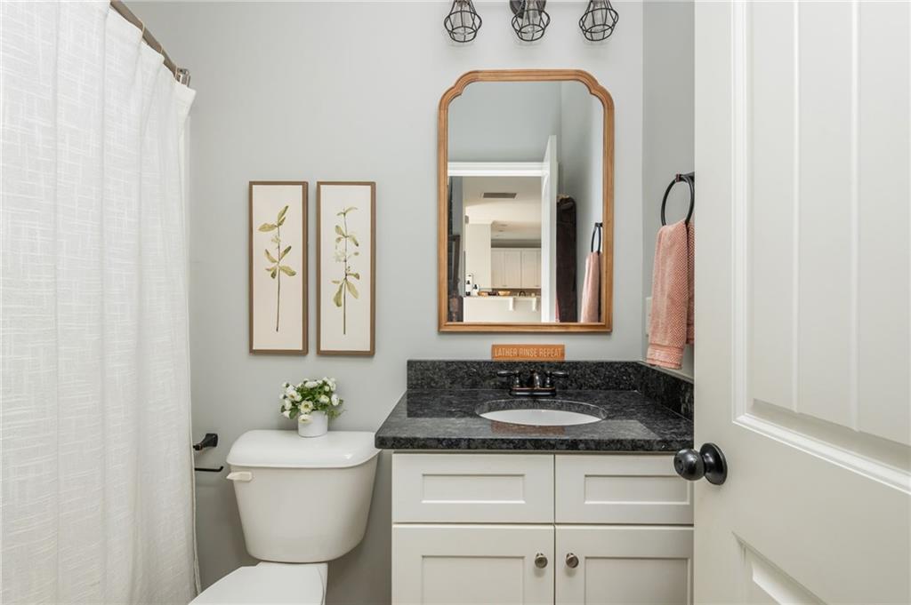 503 Pinnacle Court Canton, GA 30115 - Photo 26 of 51 a bathroom with a sink and a mirror