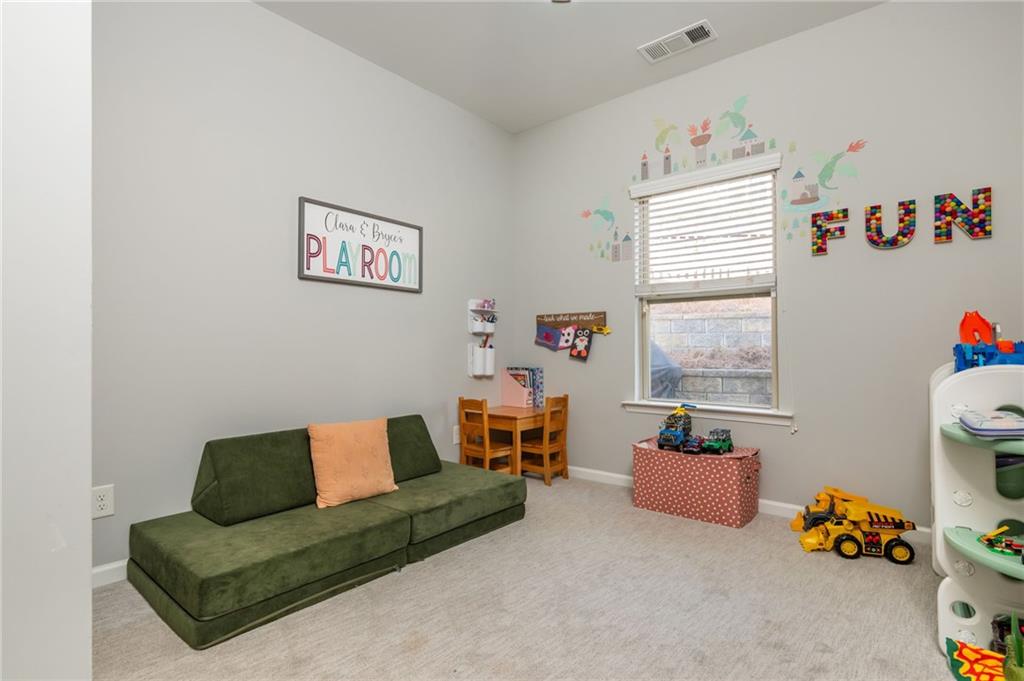 503 Pinnacle Court Canton, GA 30115 - Photo 27 of 51 a living room with furniture and a window