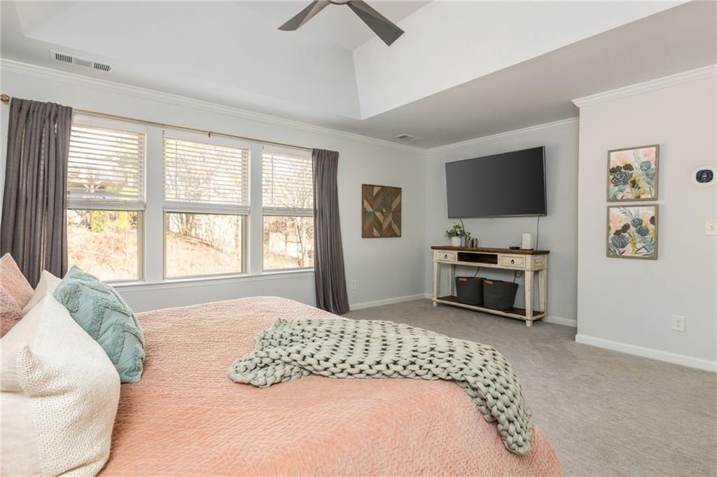 503 Pinnacle Court Canton, GA 30115 - Photo 33 of 51 a bedroom with a bed and a flat screen tv