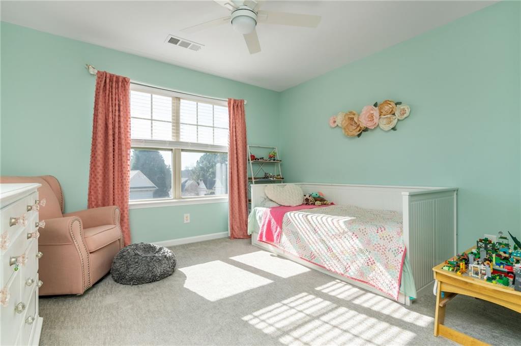 503 Pinnacle Court Canton, GA 30115 - Photo 39 of 51 a bedroom with a bed and a window