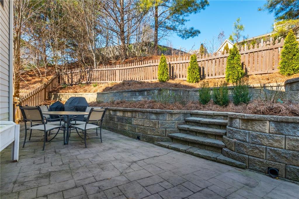 503 Pinnacle Court Canton, GA 30115 - Photo 47 of 51 a view of a chairs and tables in the back yard of the house