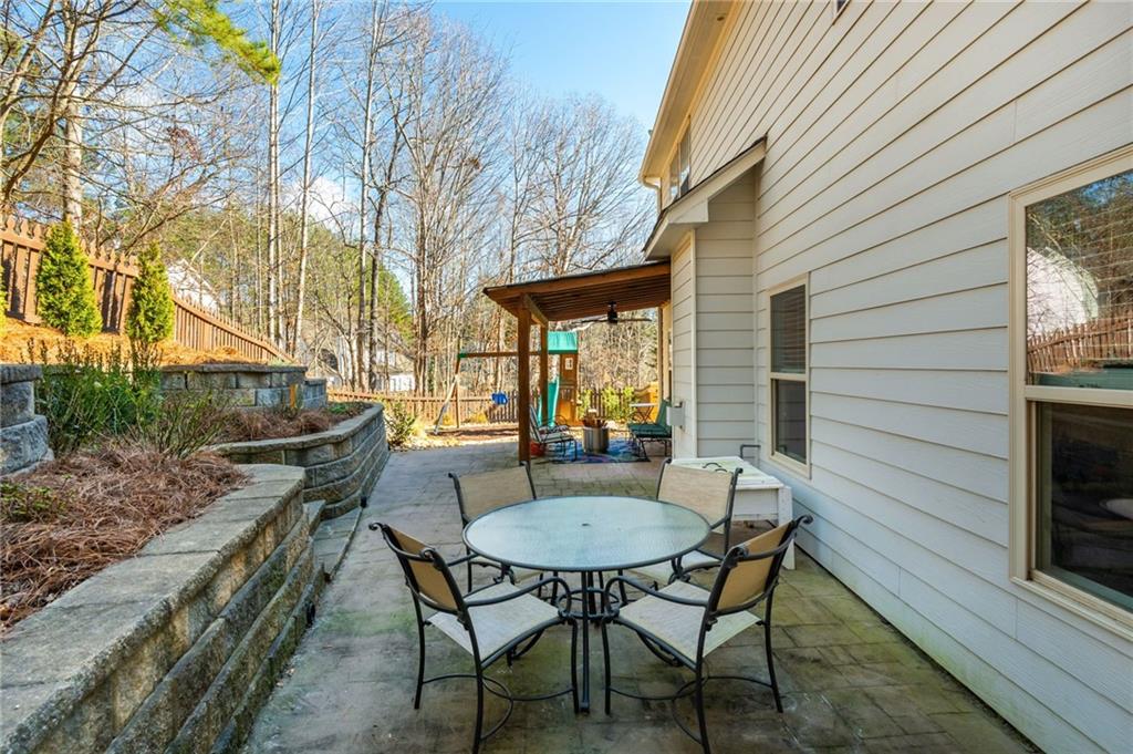 503 Pinnacle Court Canton, GA 30115 - Photo 48 of 51 a backyard of a house with table and chairs