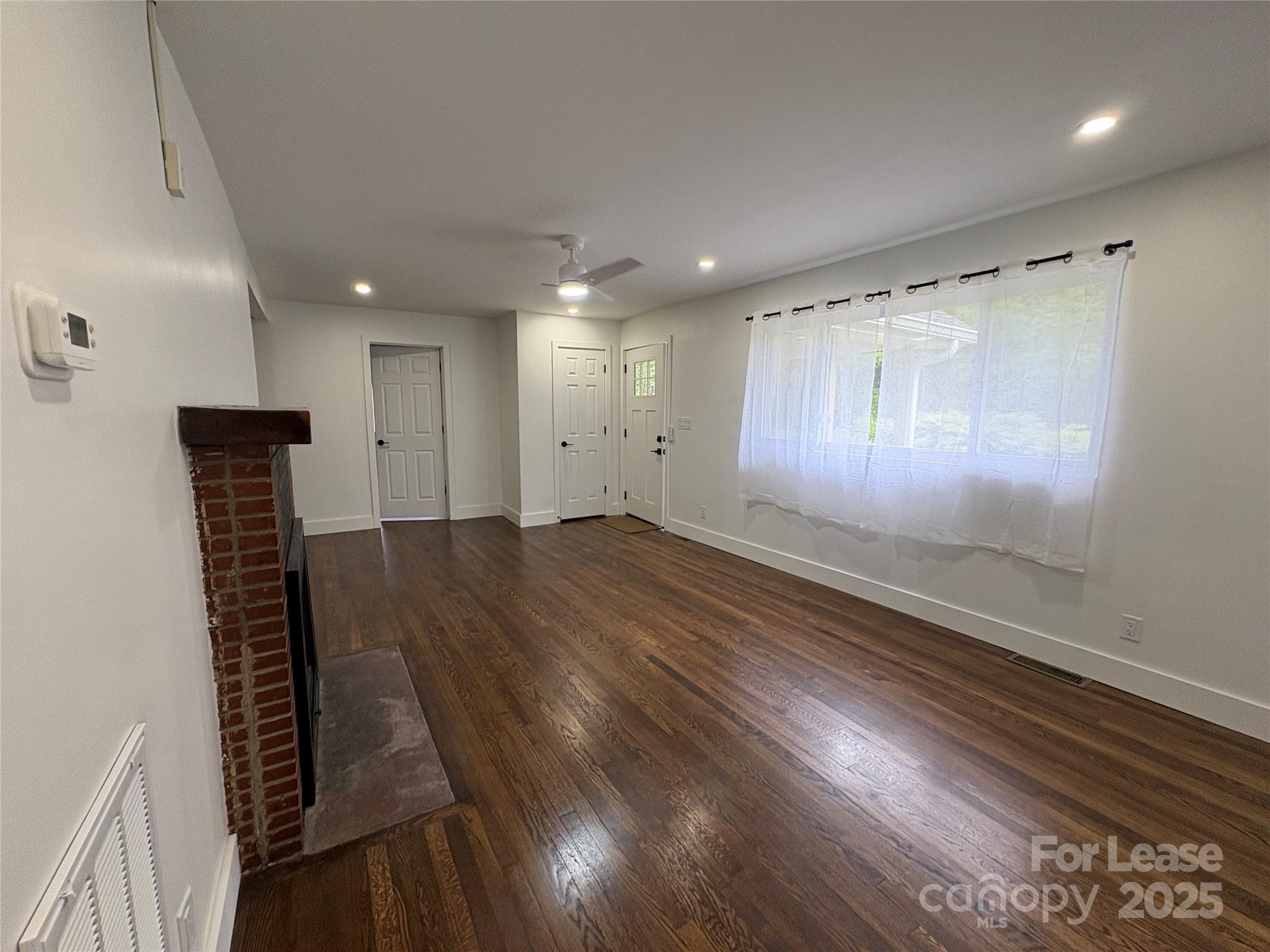 1175 Kilpatrick Road Hendersonville, NC 28739 - Photo 24 of 34 a view of an empty room with wooden floor