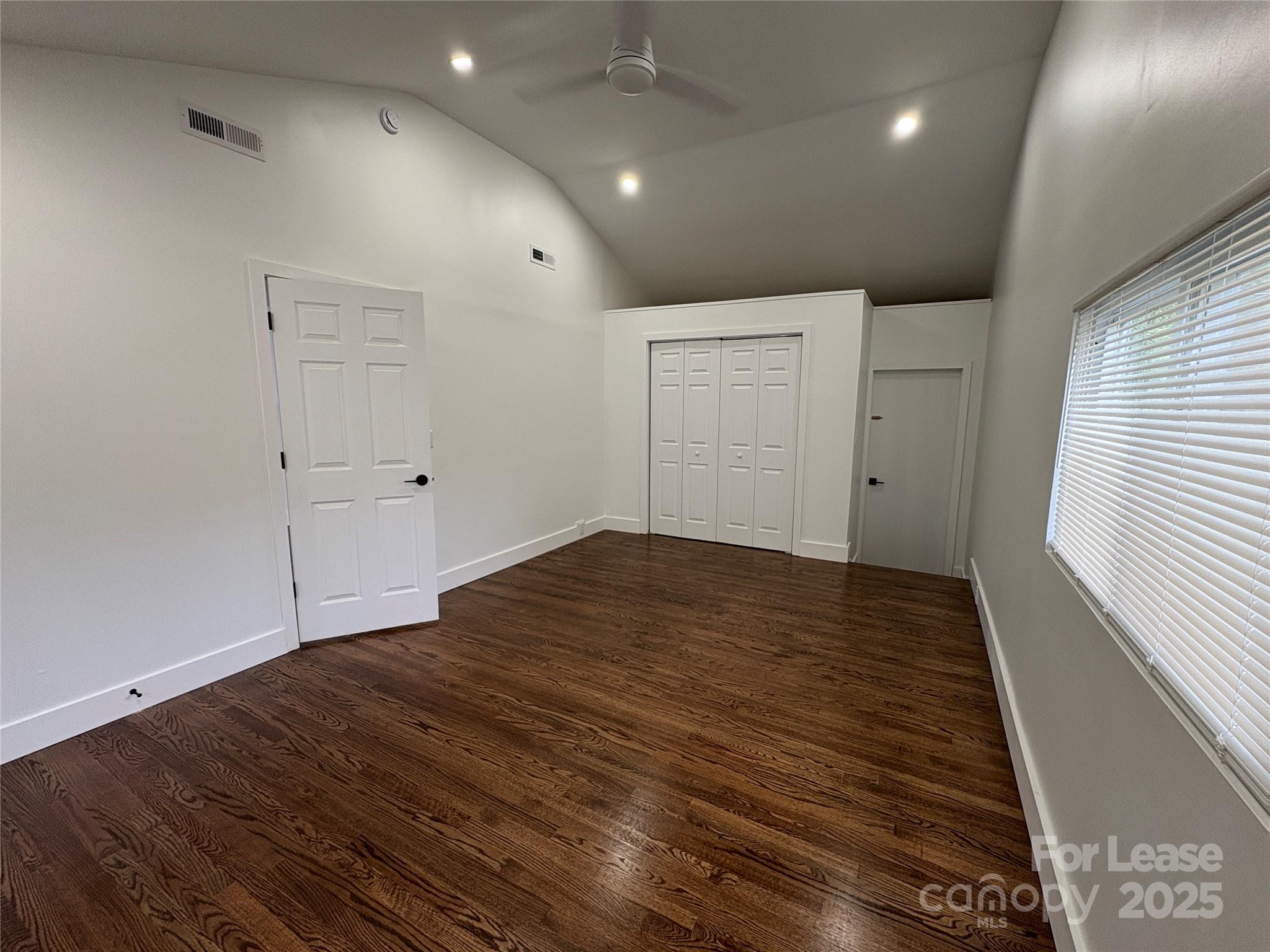 1175 Kilpatrick Road Hendersonville, NC 28739 - Photo 25 of 34 an empty room with wooden floor and cabinet