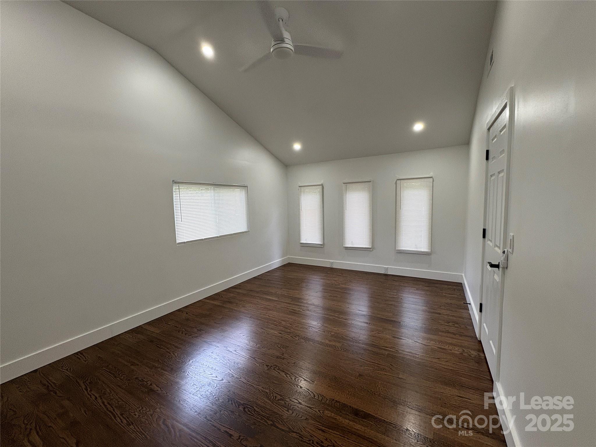 1175 Kilpatrick Road Hendersonville, NC 28739 - Photo 26 of 34 an empty room with wooden floor and windows