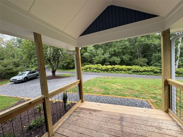 a view of a balcony with wooden floor